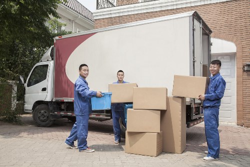 Team preparing van for rubbish removal at a residential collection point