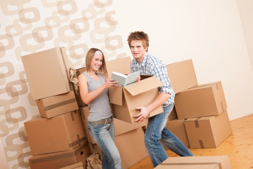 Experienced movers preparing boxes in Clapham